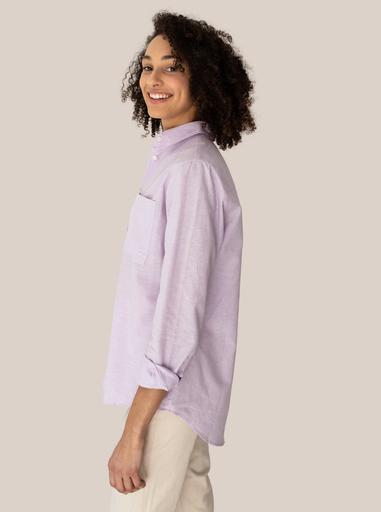 model laughing in lilac blouse