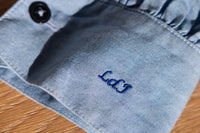 Monogram (on right cuff)