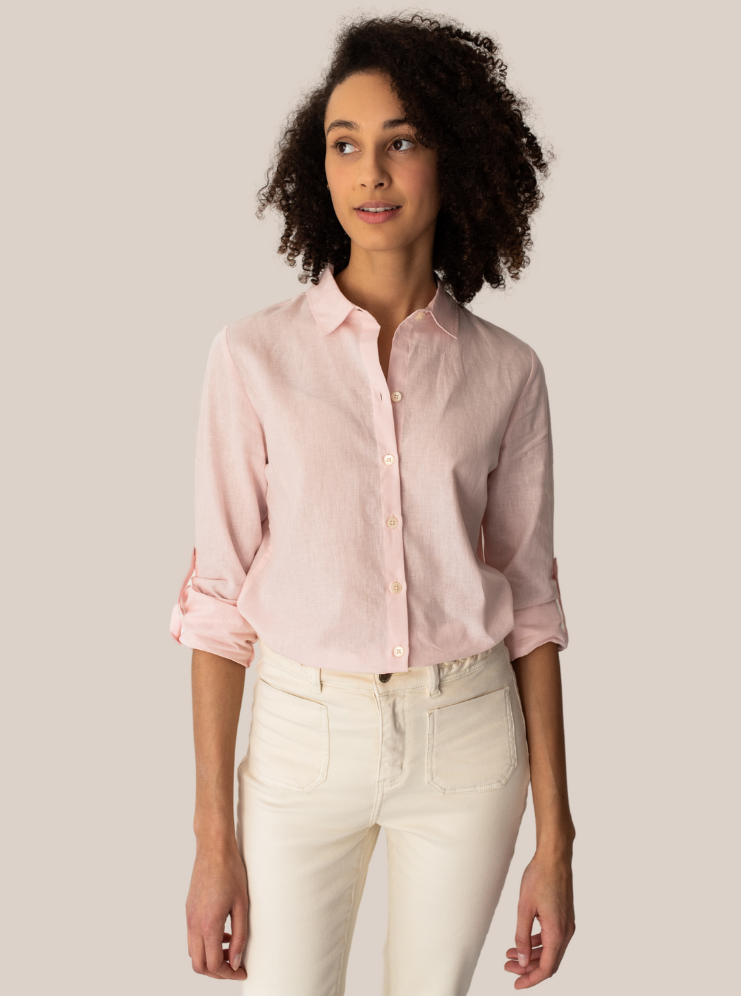 Model with fitted linen blouse in peach colour